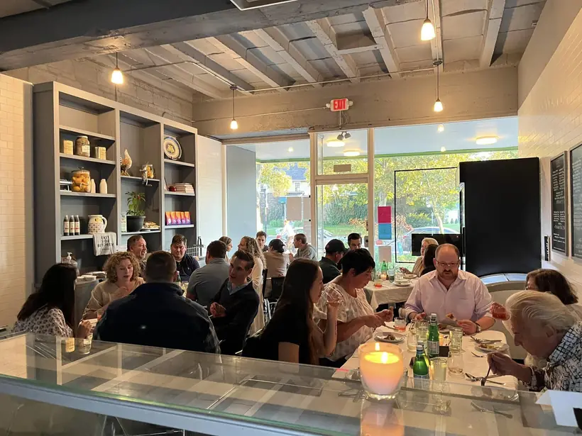 A course being plated at a Macelleria pop-up dinner