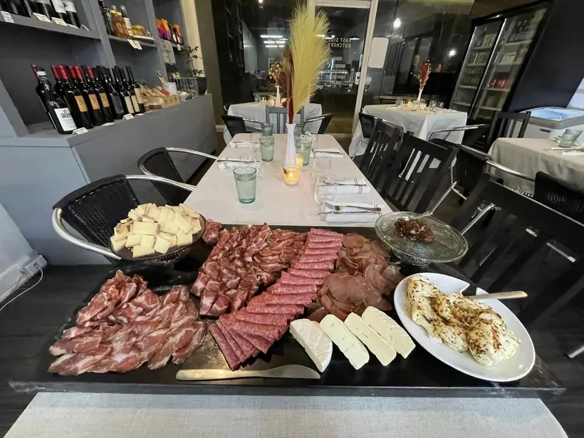 Guests seated at a Macelleria pop-up dinner